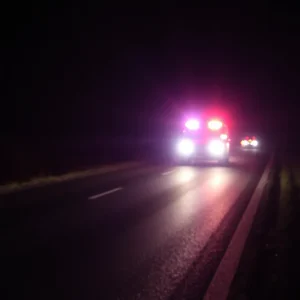 Emergency lights at a nighttime accident scene